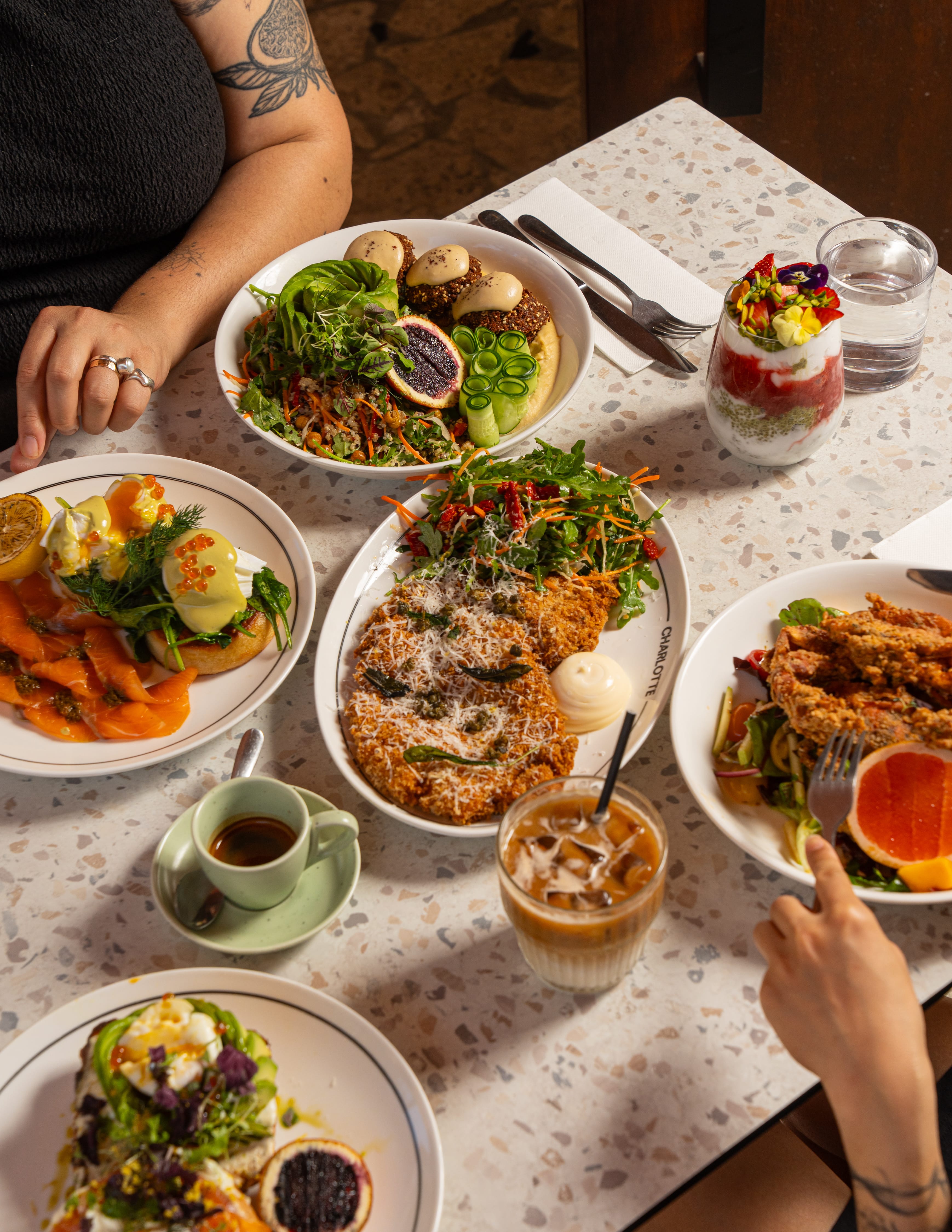 Charlotte dishes and drinks arranged on a café table