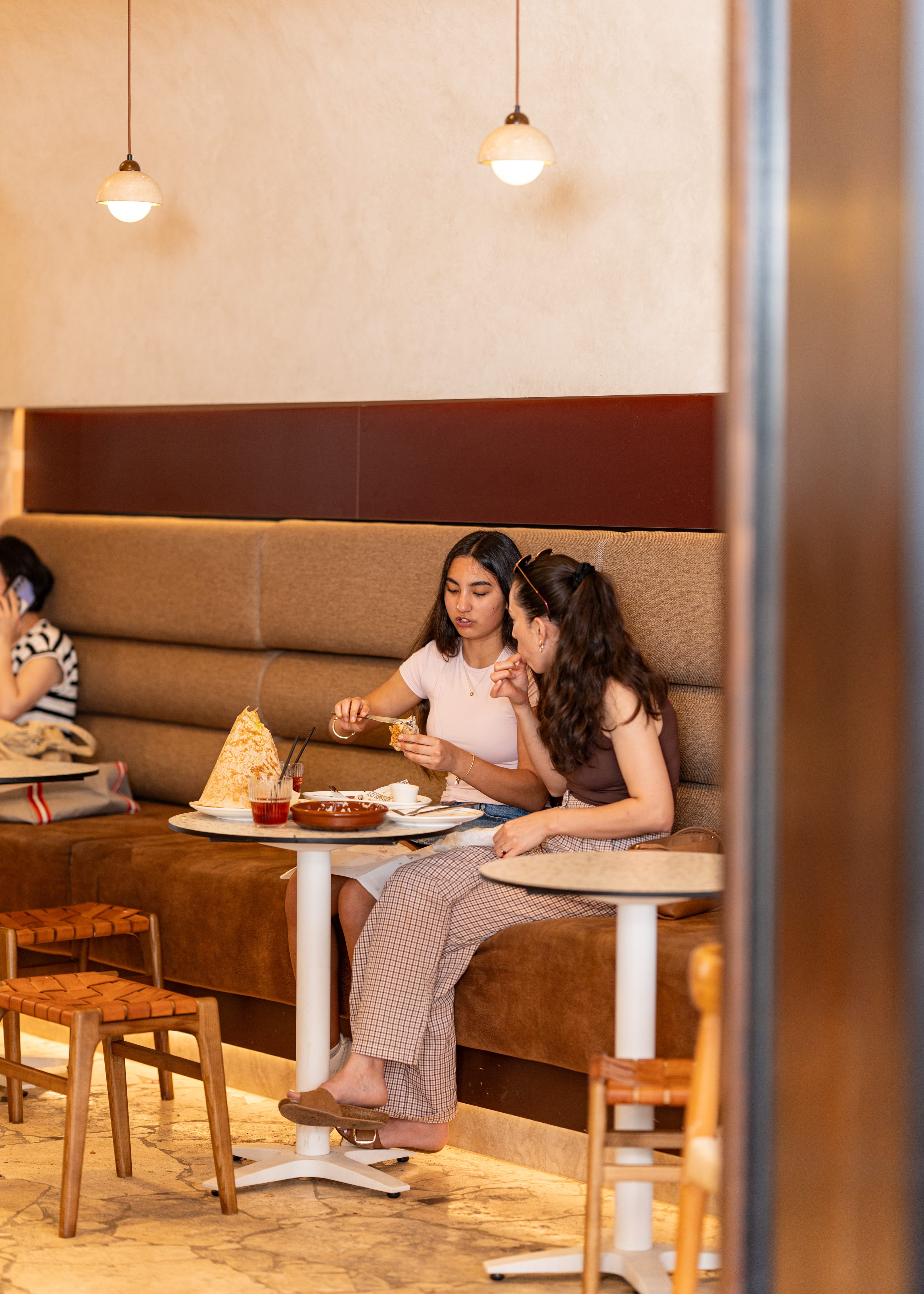 Guests dining together inside a Charlotte café